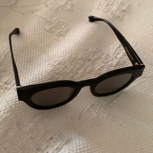 Black sunglasses with bold frames and tinted lenses